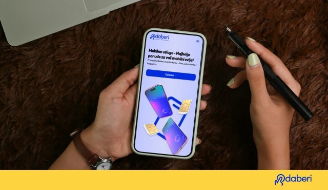 Person holding a smartphone and stylus pen