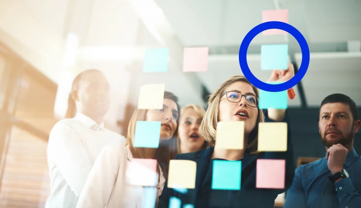 People at the office looking at notes