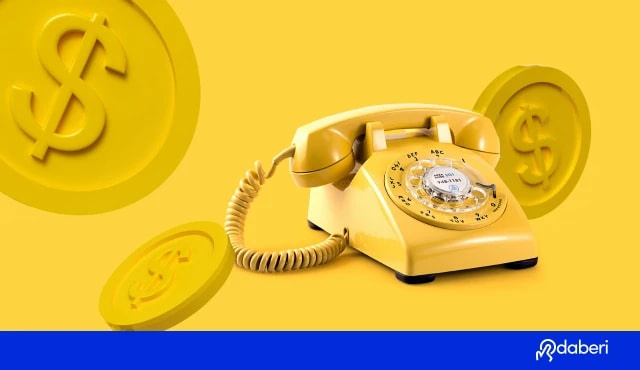 Golden telephone with golden dollar coins around